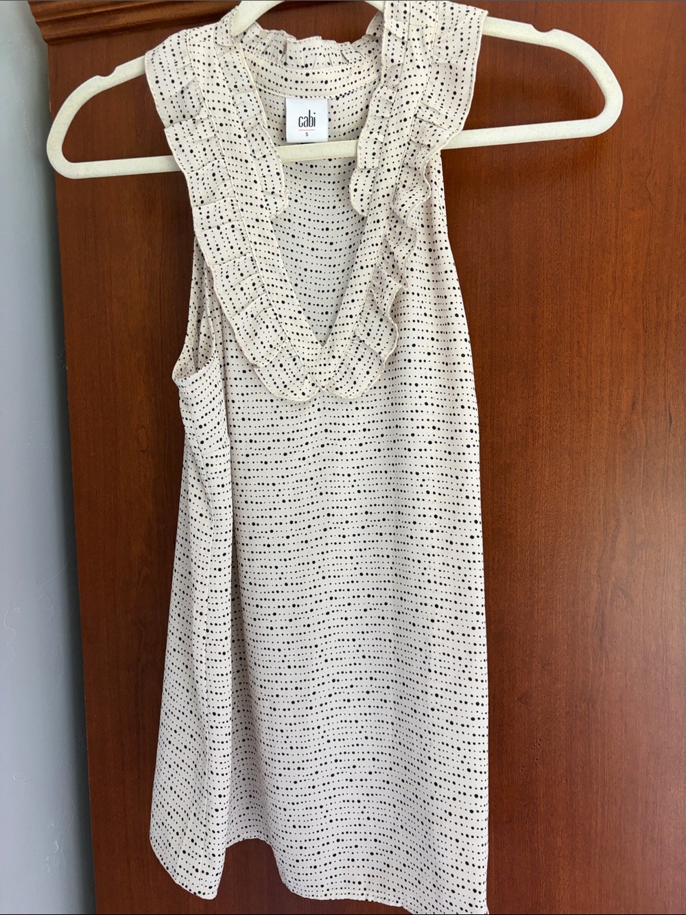CAbi Cream Sleeveless V‑Neck Ruffle Knit Top with Black Dot Pattern